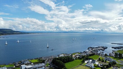 Sticker - Drone view of yachts in the bay with houses on the shore and cloudy sky