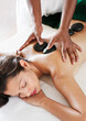© Matthew Wakem - Woman Receiving a Hot Stone Massage at a Spa, Dambulla, Sri Lanka.