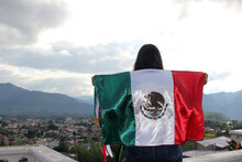 Latin Adult Woman Shows The Flag Of Mexico Proud Of Her Culture And Tradition. Celebrate The Mexican Soccer Team And The National Holidays Of Independence And Cinco De Mayo