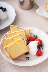 Wall Mural - Classic vanilla or lemon pound cake served with fresh berries and whipped cream