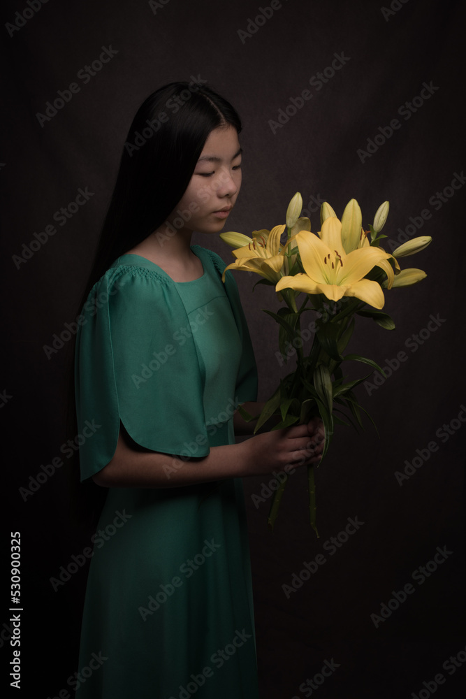classic studio fine art portrait of asian woman in green dress holding ...