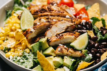 Sticker - Wide-angle close-up of a chicken taco salad