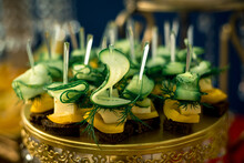 Many Canapes Of Cucumbers, Cheese, Herbs And Paprika