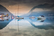 Sailboats in Achensee lake near Innsbruck at peaceful dawn, Tyrol alps, Austria