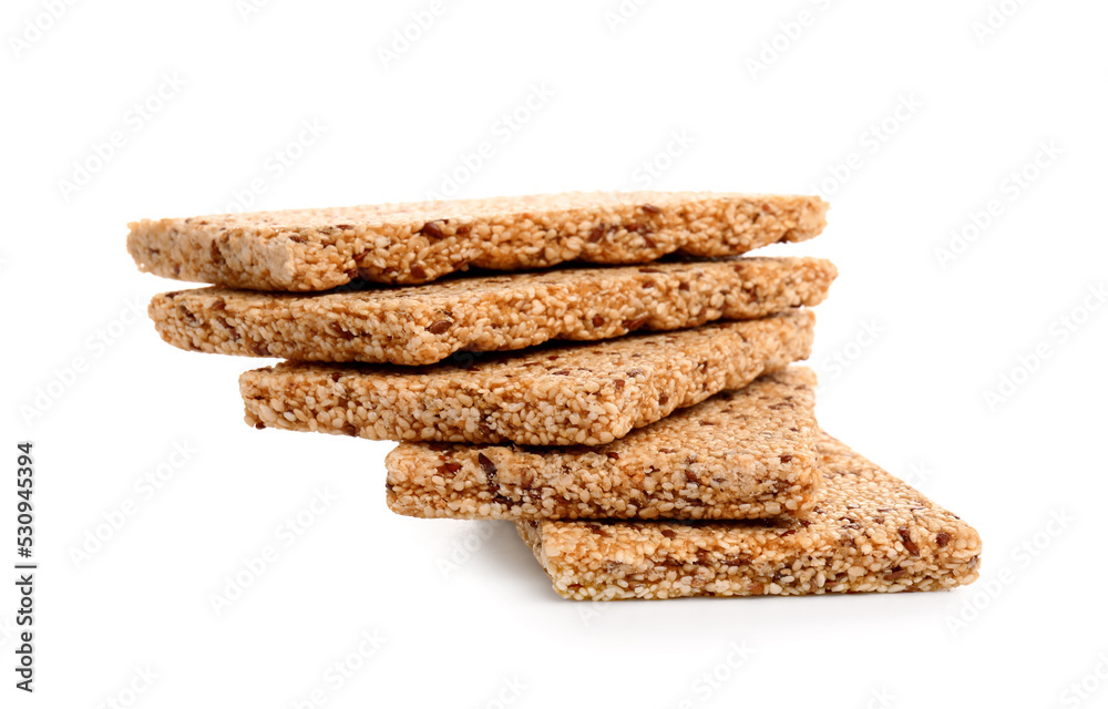 Stack of tasty sesame kozinaki on white background