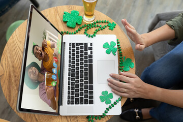 Poster - Mid section of woman waving while having a video conference on laptop at a bar