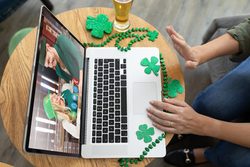 Poster - Mid section of woman waving while having a video conference on laptop at a bar