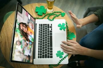 Poster - Mid section of woman waving while having a video conference on laptop at a bar