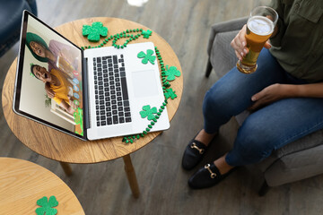 Sticker - Caucasian woman holding beer at bar making st patrick's day video call with friends on laptop