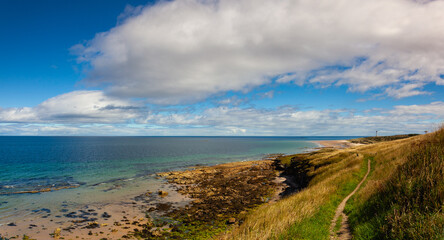 Covesea Skerries Lighthouse on the empty beach