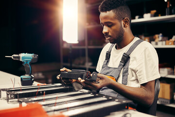 Wall Mural - factory worker doing quality control at the production line