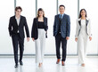 © Bangkok Click Studio - Full body shot of Millennial Asian successful professional male businessmen and female businesswomen in formal suit smiling posing look at camera walking side by side together in company hallway