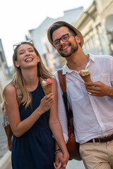 Wall Mural - holidays, vacation, love and friendship concept. smiling couple having fun