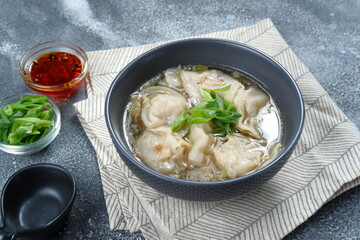 Wall Mural - delicious of wonton soup with chili oil and green onion,chinese food,asian food style 