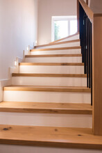 Wood Staircase Inside Contemporary White Modern House.