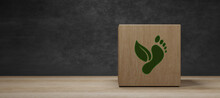 Carbon Ecological Footprint Symbols On Wooden Cubes With Eco Friendly Icons. Zero Emission Concept. Sustainable Development Strategy. Environmental, Climate Change Concept; 3D Illustration
