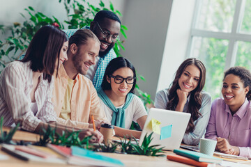 Photo of positive attractive businesspeople watching video presentation indoors workstation workshop restroom