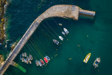 Aerial View Of Fishing Boats In Mevagissey Harbour, Cornwall, England