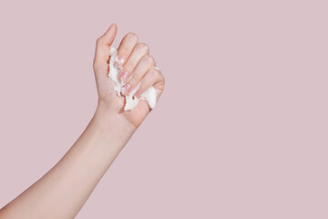 Wall Mural - Female hand with scrub on pink background. Skin care concept.