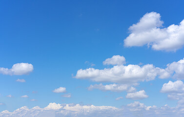 Wall Mural - clear blue sky background with white clouds