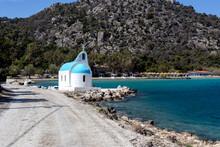 The Orthodox Church On The Shore Of Lake Vulyagmeni (district Loutraki, Greece) And Road Along The Sea