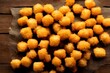 High-angle close-up view of fried Tater tots over the wooden surface
