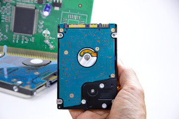 Poster - Hard disk drives are still widely used. hard drive in hand (Cut path included in this picture)