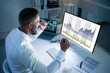 © Andrey Popov - Successful Stock Market Trader Looking At Graphs