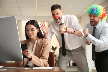 Sticker - Men popping paper bag behind their colleague in office. Funny joke