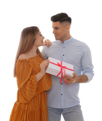 Wall Mural - Lovely couple with gift box on white background. Valentine's day celebration