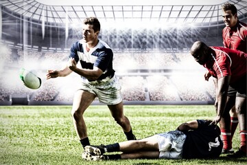 Canvas Print - Digital composite image of team of rugby players playing rugby in sports stadium