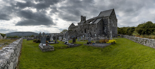 Sticker - panorama view of the historic 13th-century Corcomroe Abbey and cemetery in County Clare