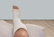 ankle and foot splint Bandages on the legs. Foot surgery, Wrapped feet with plaster or pressure bandage after operation
