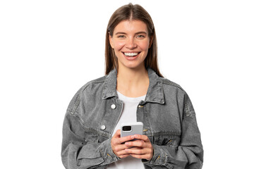 pretty woman with fair hair holding mobile phone laughing at memes, surfing internet
