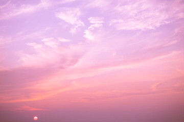 Wall Mural - sunset,pink sky, dusk clouds in the evening, peaceful nature gorgeous sunlight background.