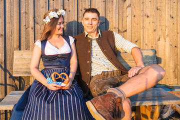 Wall Mural - Oktoberfest, woman and man in Bavarian costume with beer mugs