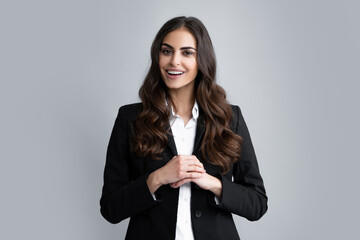 Happy smiling woman portrait. Attractive young pretty cheerful girl in casual clothing feeling happy and carefree, isolated gray background. Female employee young secretary.