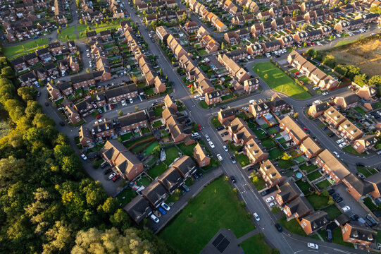 top down aerial view of houses and streets in a residential area uk new build estate agent house pri