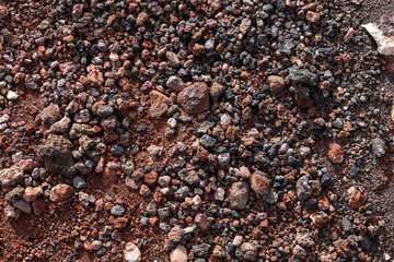 Colorful background volcanic rock on Etna volcano in Sicilia