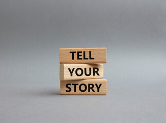 Tell your story symbol. Wooden blocks with words Tell your story. Beautiful grey background. Business and Tell your story concept. Copy space.