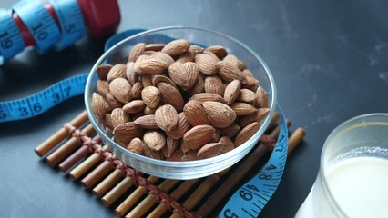 Wall Mural -  almond nut and milk on table 