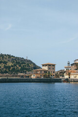 Beautiful look at mediterranean seaport with two lighthouses at horizon  