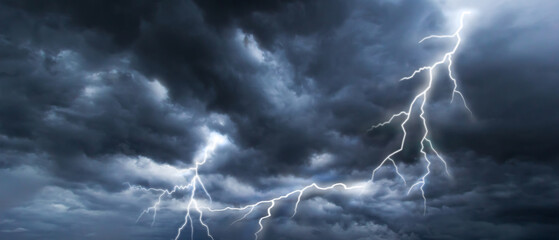 Wall Mural - The dark sky with heavy clouds converging and a violent lightning storm before the rain.Bad or moody weather sky and environment. carbon dioxide emissions, greenhouse effect, climate change.