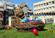easter concept. basket with Easter eggs on the grass. against the backdrop of beautiful nature. tulips. spring beautiful bloom of nature. with an easter bunny in the background