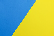 A Graphic Representation Of Two Geometric Shapes Of Two Colors: Yellow, Blue.