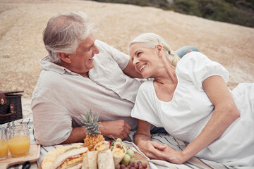 Canvas Print - Love, couple and picnic with a senior man and woman on an outdoor date with food and juice in summer. Happy, smile and romance with an elderly male and female enjoying free time together and bonding