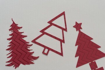 Poster - three stylized holiday trees on beige paper