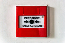 Emergency Button Written In Portuguese Press To Activate