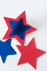 Sticker - blue and red stars (some out of focus) on a white background