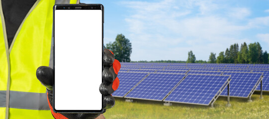 Poster - Solar energy. Phone blank screen. Man with smartphone in front of solar power plant. Getting energy from suns rays. Phone with blank screen. Solar panels are located on lawn. Place for apps in phone